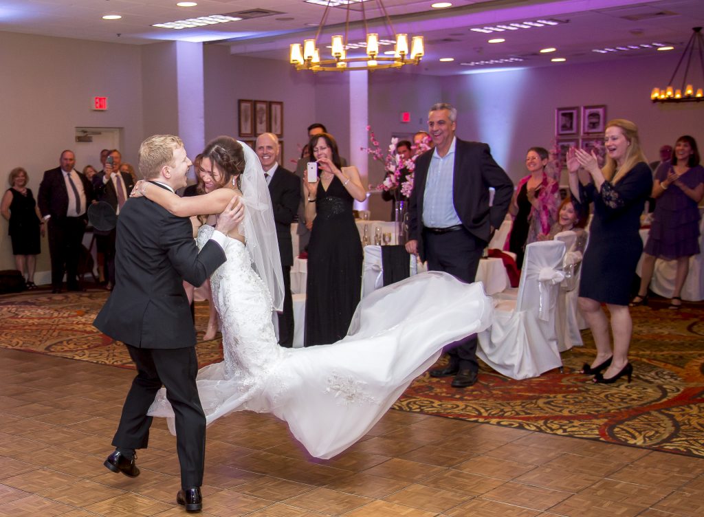 A Princess Bride trusts her groom to catch her and the photographer to get the shot.