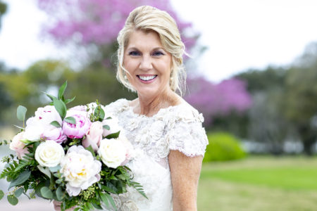 Note how much happiness this portrait of an early summer bride radiates.