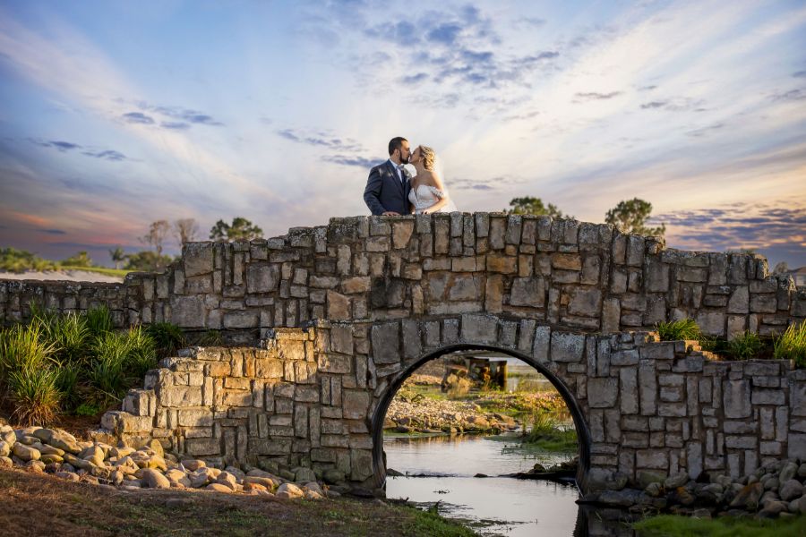 Bride and Groom on a rock bridge